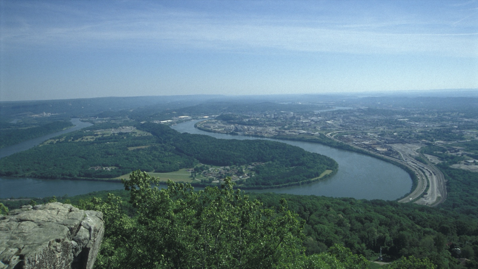 The view from Lookout Mountain: the Tennessee River curling around Moccasin Bend, Chattanooga beyond, and distant ridges fading into haze